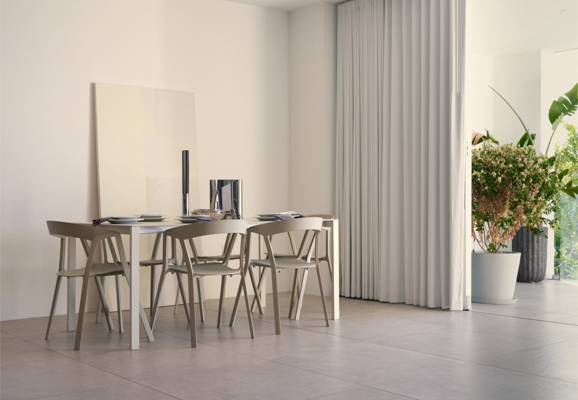 Minimalist dining area with neutral tones, natural light, and large potted plants at the terrace.