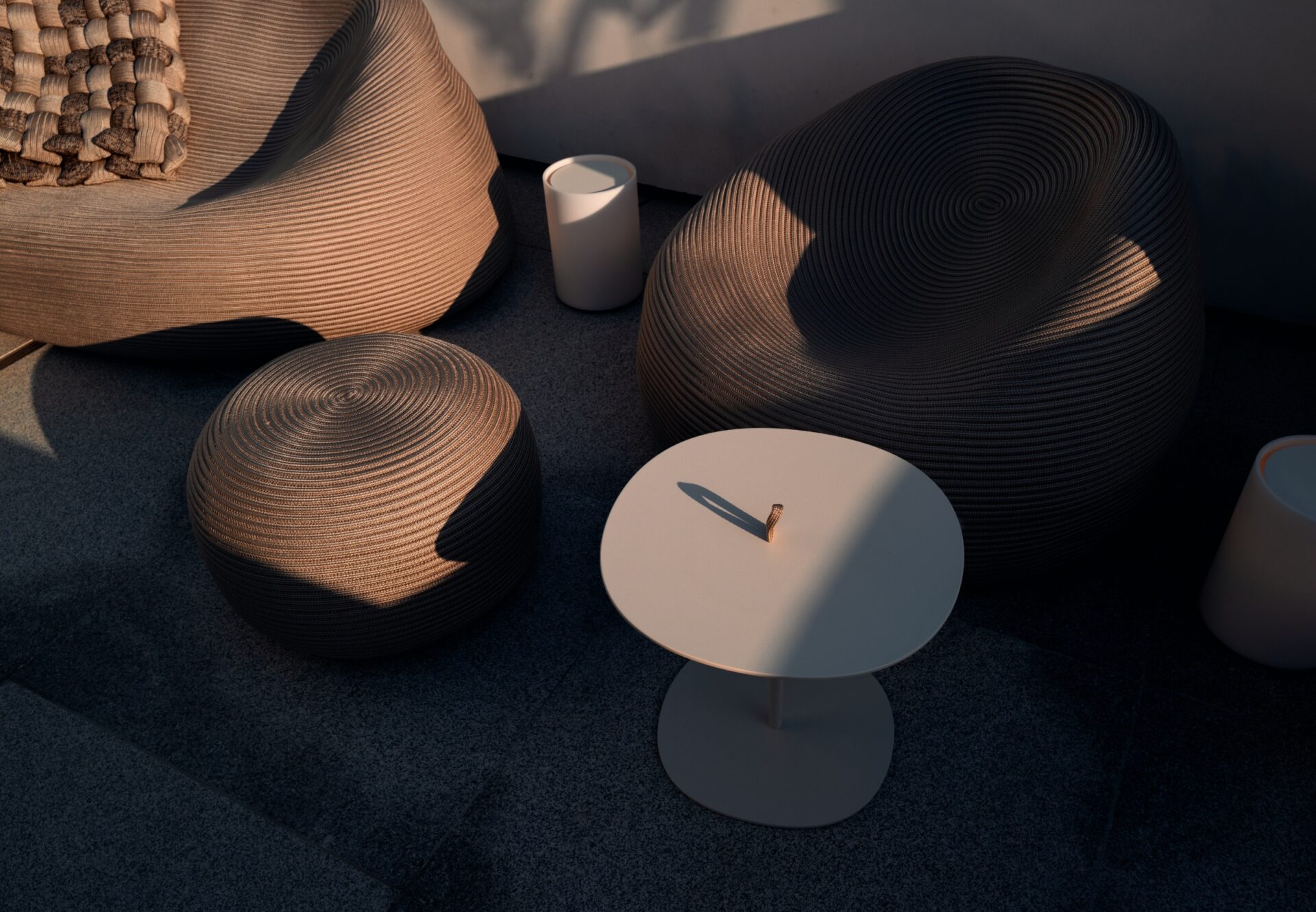 Rooftop sundeck seating vignette with sculptural Paola Lenti furniture and soft sunset shadows.